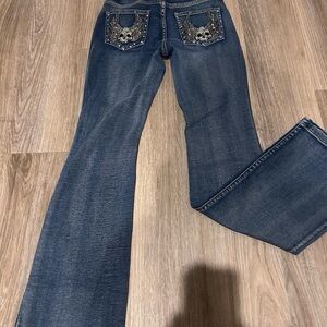Edgy Blue Flare Jeans with Skull Detail